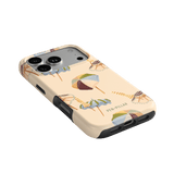 Umbrellas iPhone case featuring a light beige background with colorful umbrella designs and a textured finish.