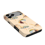 Umbrellas iPhone case featuring a light beige background with colorful umbrella designs and a black edge.