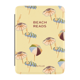 Umbrellas Kindle case featuring a yellow background with colorful beach umbrellas and the text "Beach Reads.