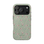Vine+Bloom iPhone case featuring a floral pattern with pink flowers on a green background.