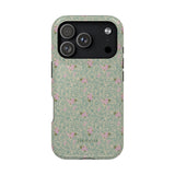 Vine+Bloom iPhone case featuring a floral pattern with pink flowers on a green background.