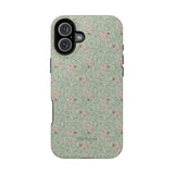 Vine+Bloom iPhone case featuring a floral pattern with pink flowers on a green background.