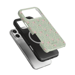 Vine+Bloom iPhone case featuring a floral design on a green background, layered over a black and silver case.