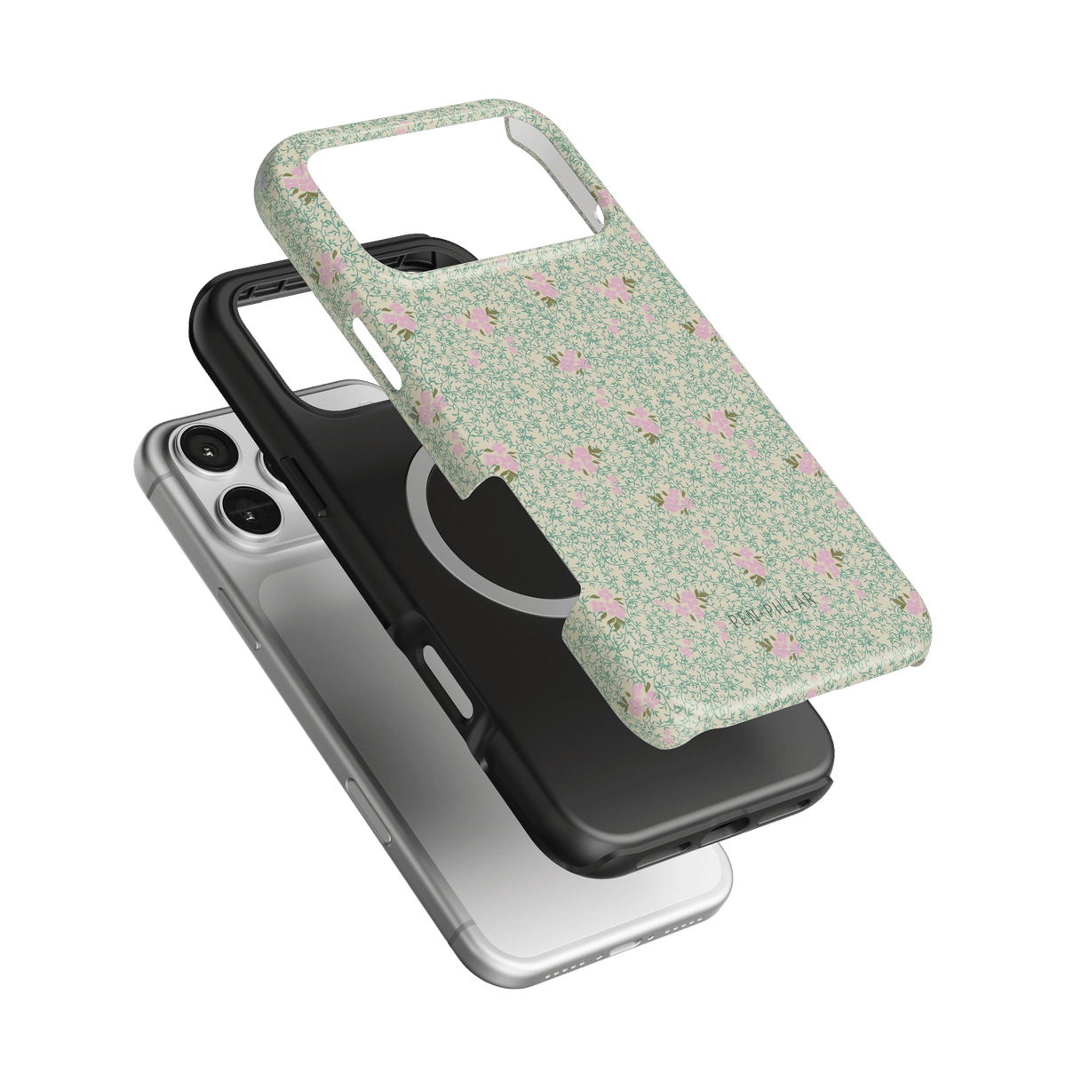 Vine+Bloom iPhone case featuring a floral design on a green background, layered over a black and silver case.