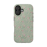 Vine+Bloom iPhone case featuring a floral pattern with pink flowers on a green background.