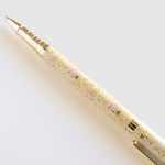 Vine+Bloom metal pen with a floral yellow and pink design, featuring a gold clip and tip.