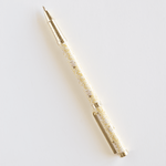 Vine+Bloom metal pen with a gold and white floral design, featuring a retractable tip and clip for easy carrying.