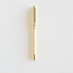 Vine+Bloom metal pen with a gold finish and a glittery yellow barrel on a white background.