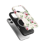 Viola iPhone case featuring a floral design with pink and purple flowers on a cream background, stacked with two other cases.