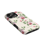 Viola iPhone case featuring a floral design with pink and green accents on a cream background.