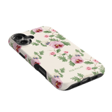 Viola iPhone case featuring a floral design with pink and purple flowers on a cream background.