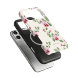 Viola iPhone case featuring a floral design with pink and purple flowers on a white background, layered over a black case.