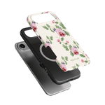 Viola iPhone case featuring a floral design with pink and purple flowers on a white background, shown from multiple angles.