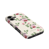 Viola iPhone case featuring a floral design with pink and purple flowers on a cream background.