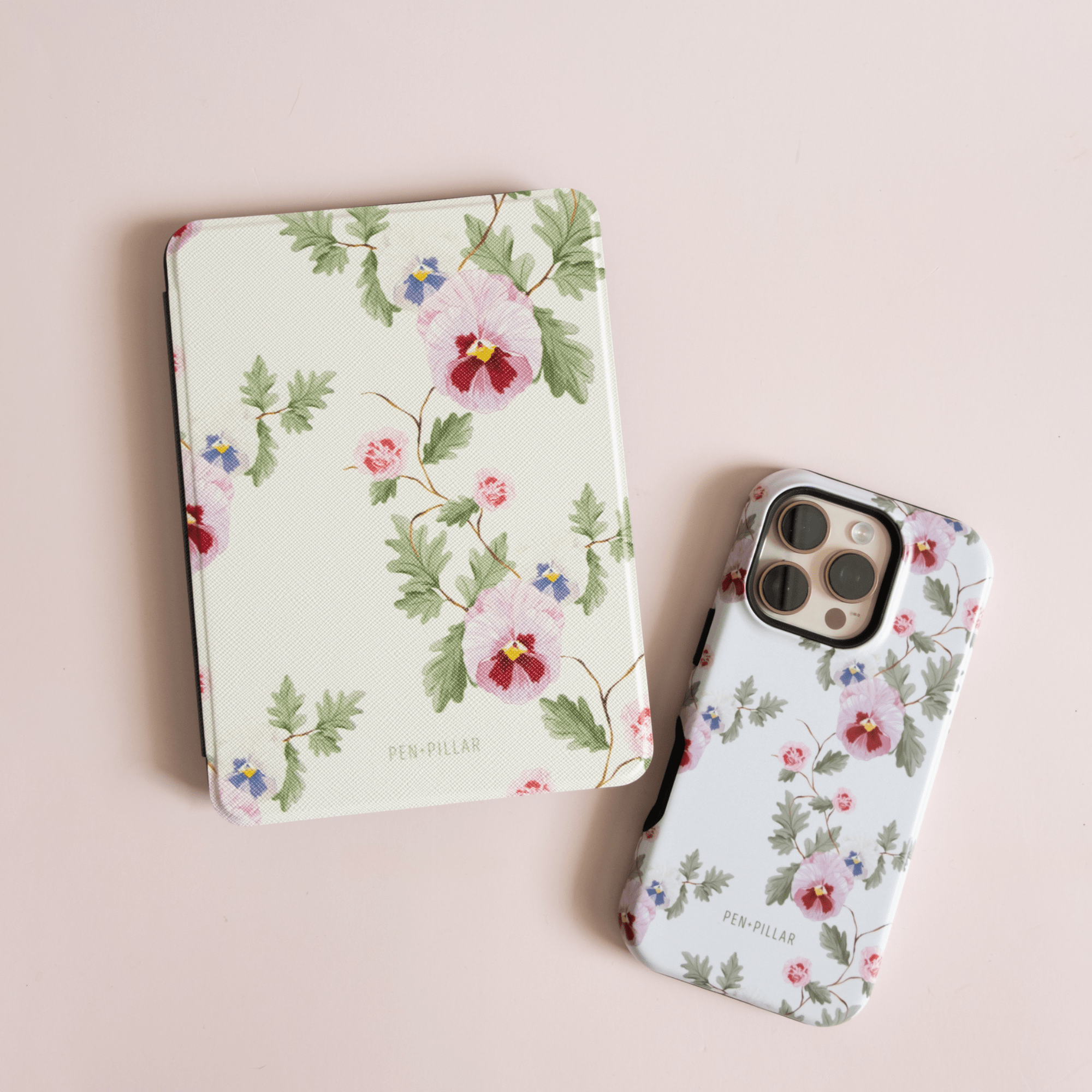 Viola Kindle case featuring a floral design with pansies and roses on a light background.