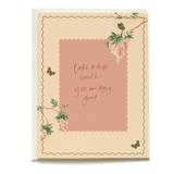 Wisteria sympathy card featuring pink background, floral design, and handwritten message in elegant script.