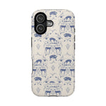 Woodland iPhone case featuring a blue and cream pattern with deer and floral designs on a sleek surface.