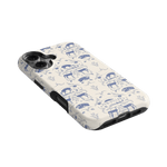 Woodland iPhone case featuring a blue and white animal print design on a cream background, angled view.