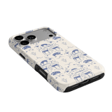 Woodland iPhone case featuring a blue and white animal print design with elephants and floral elements.
