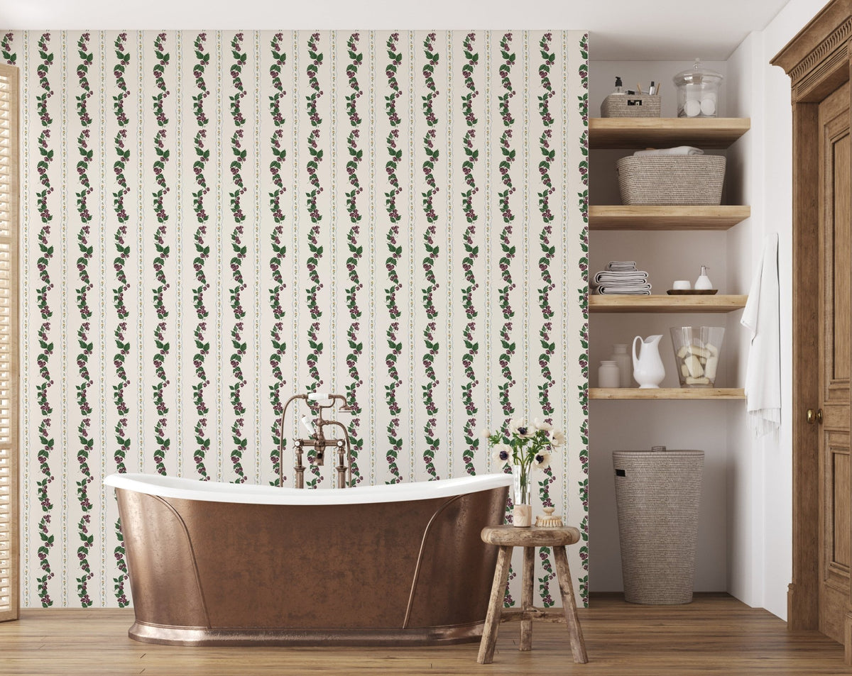 Wrenley Wallpaper by Pen and Pillar featuring vertical floral vines behind a copper bathtub in a bathroom.