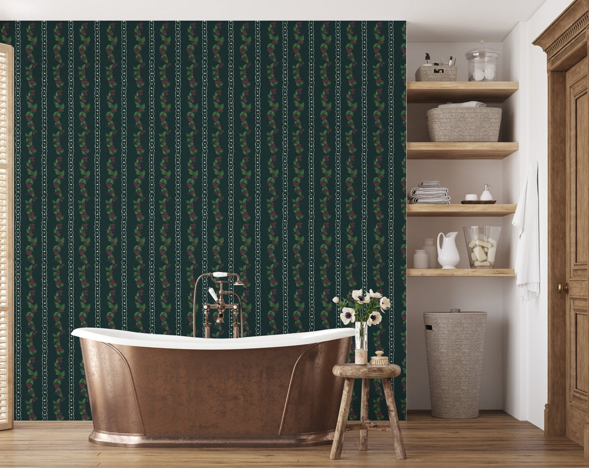 Dark green Wrenley wallpaper with vertical floral and chain patterns behind a copper bathtub in a bathroom.