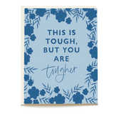 Sympathy card with blue floral border and text reading "This is tough, but you are tougher" on a light blue background.